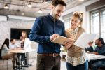 Man and woman working together in a modern office