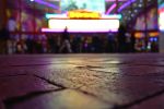 Blurred view of city stores from street level