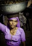 Indian girl carrying bowl