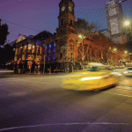 Melbourne street with passing taxi cab